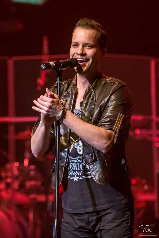 Dominic Haygood singing onstage