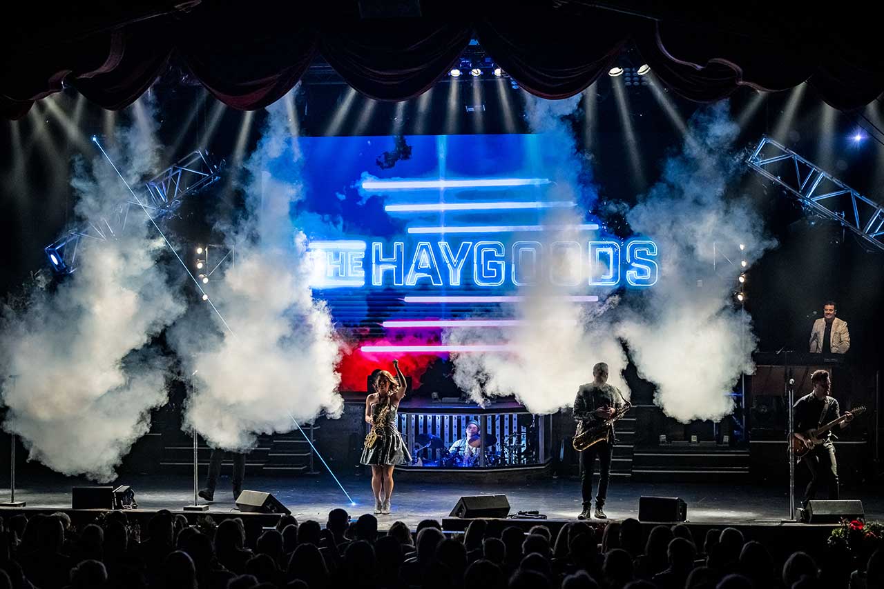 The Haygoods performing across a smoke-filled stage in Branson