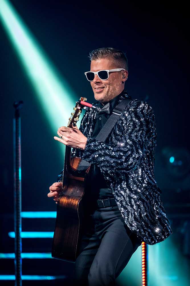 Timothy Haygood playing guitar onstage